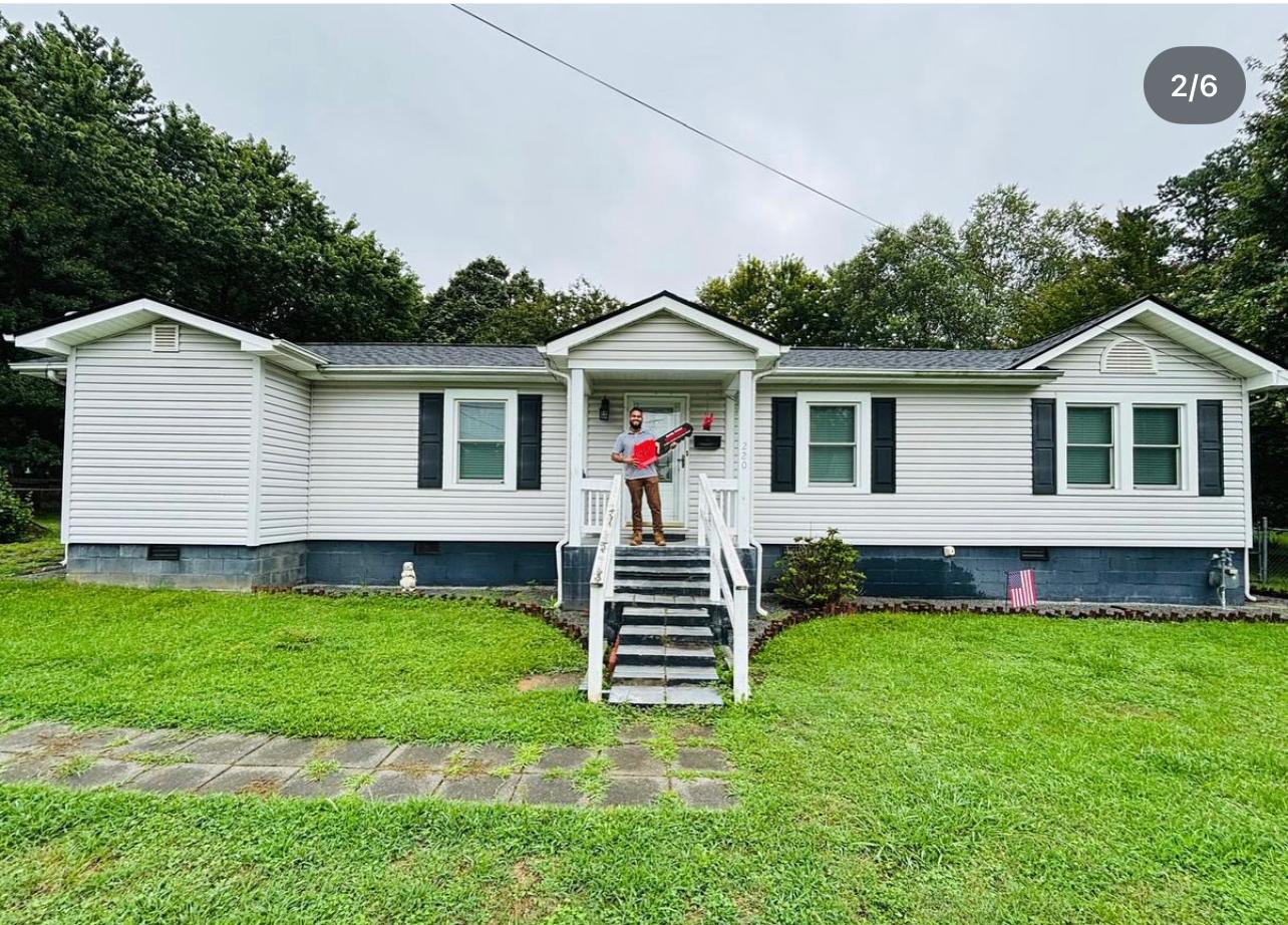 Sold home in Belmont NC — happy clients on their front porch
